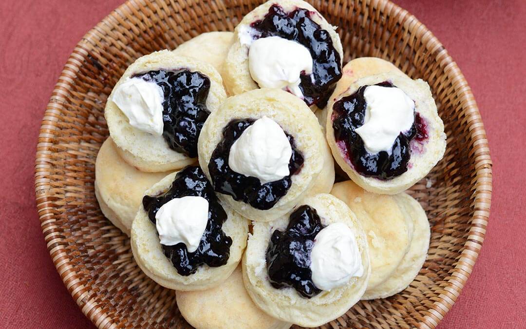 Scones with cream and jam ontop