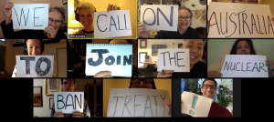 Zoom meeting with people holding up signs