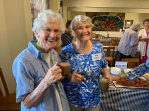 Two older women standing together