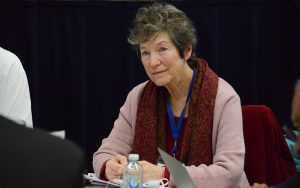 Woman sitting pensively at table