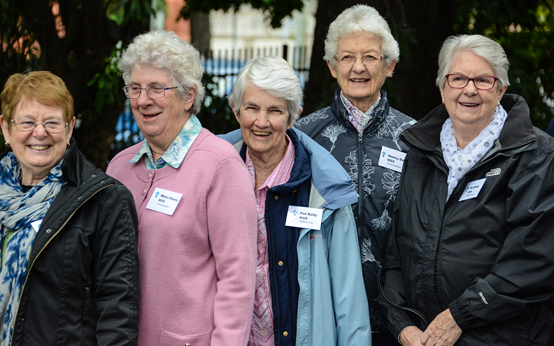Five elderly women in a row