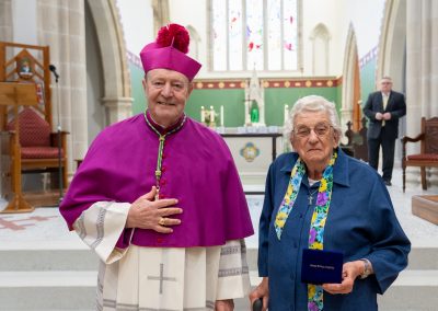 Archbishop and older woman standing side by side Lorraine Groves