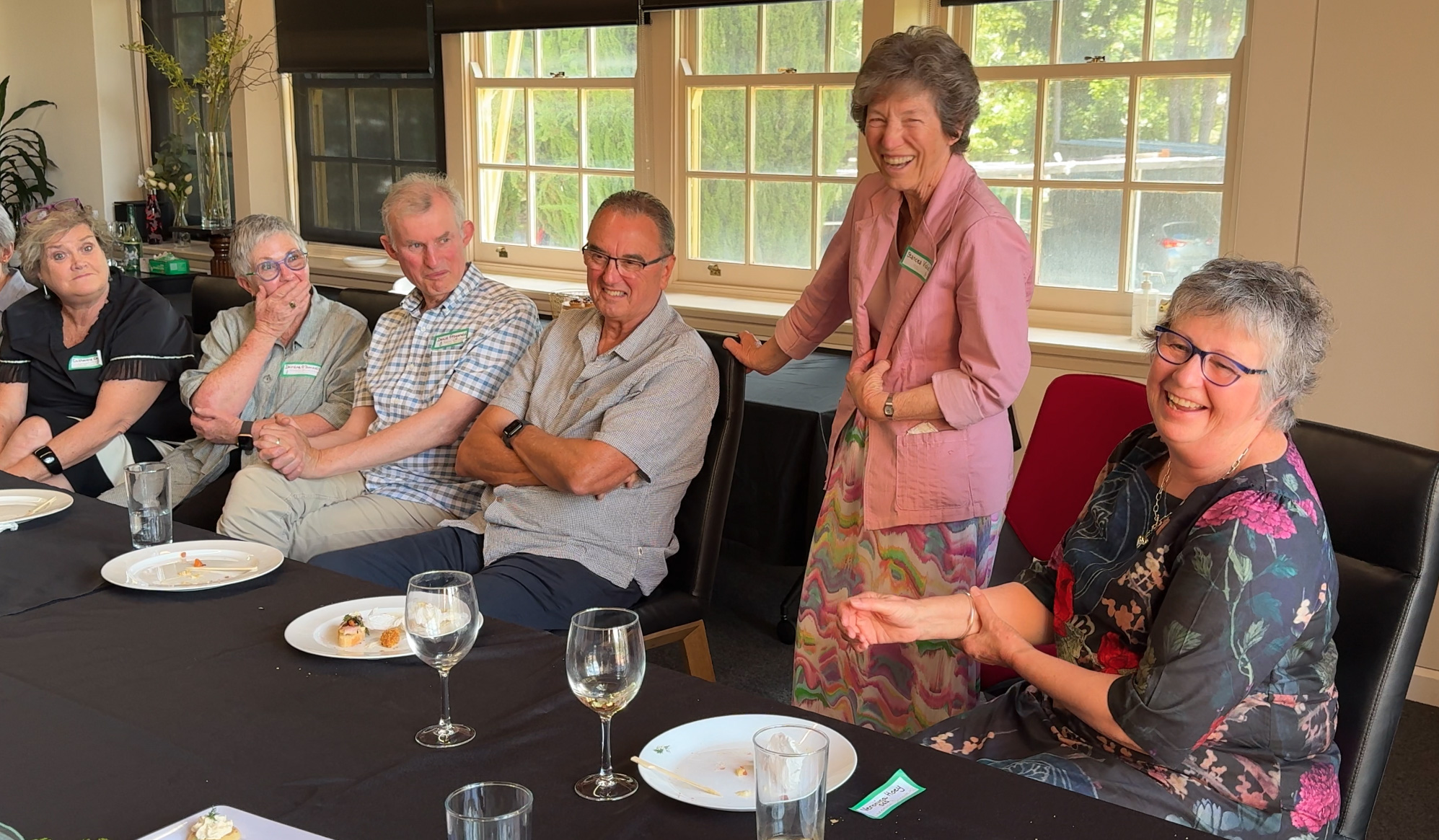 People around the table laughing