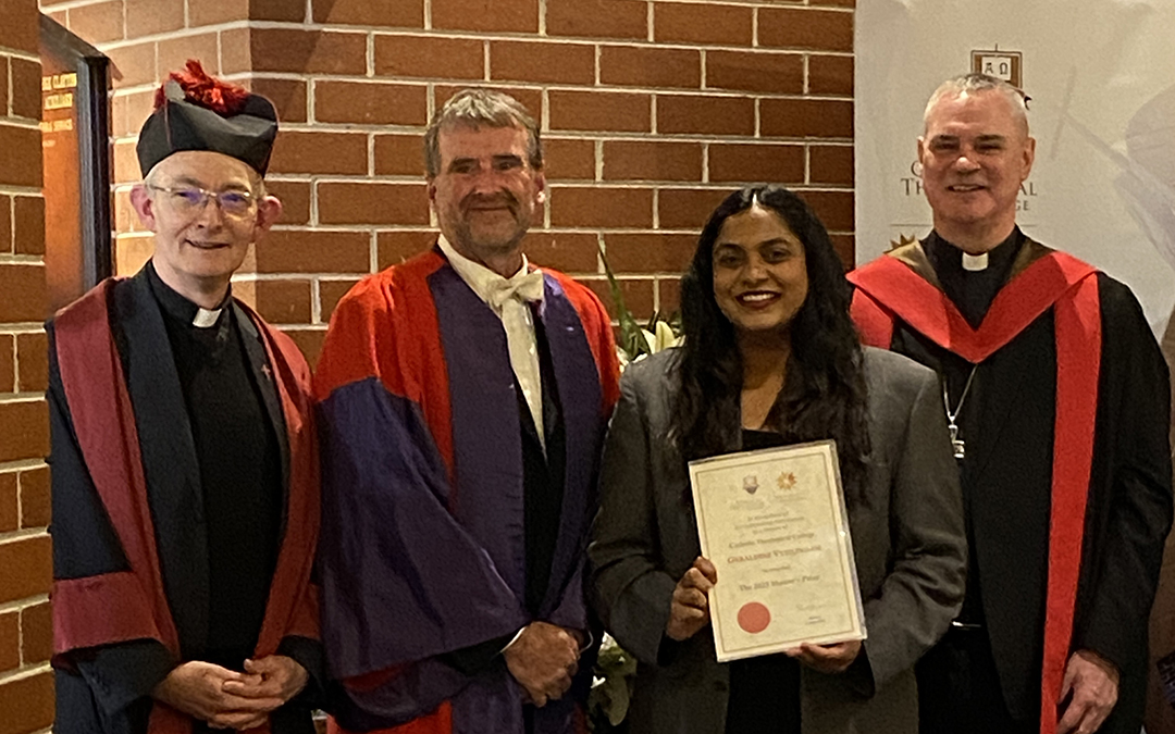 University graduates and official in line
