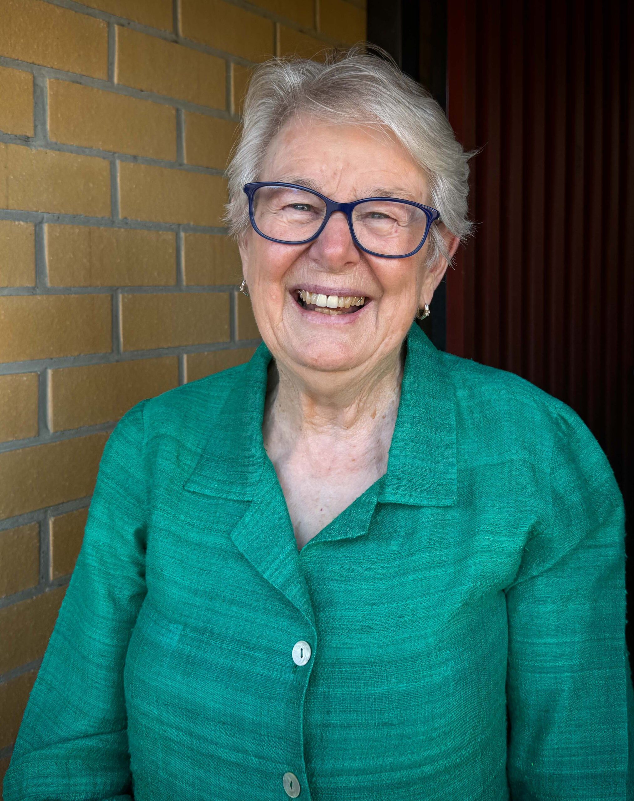 Woman standing in doorway Bernadette Wallis MSS