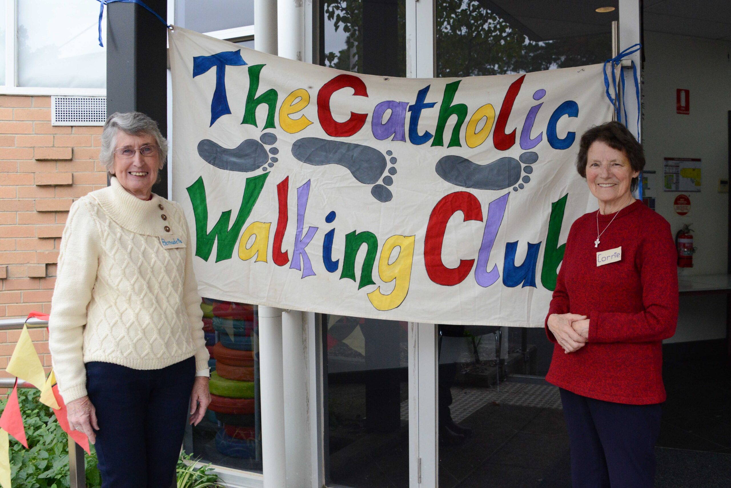 Two women with banner