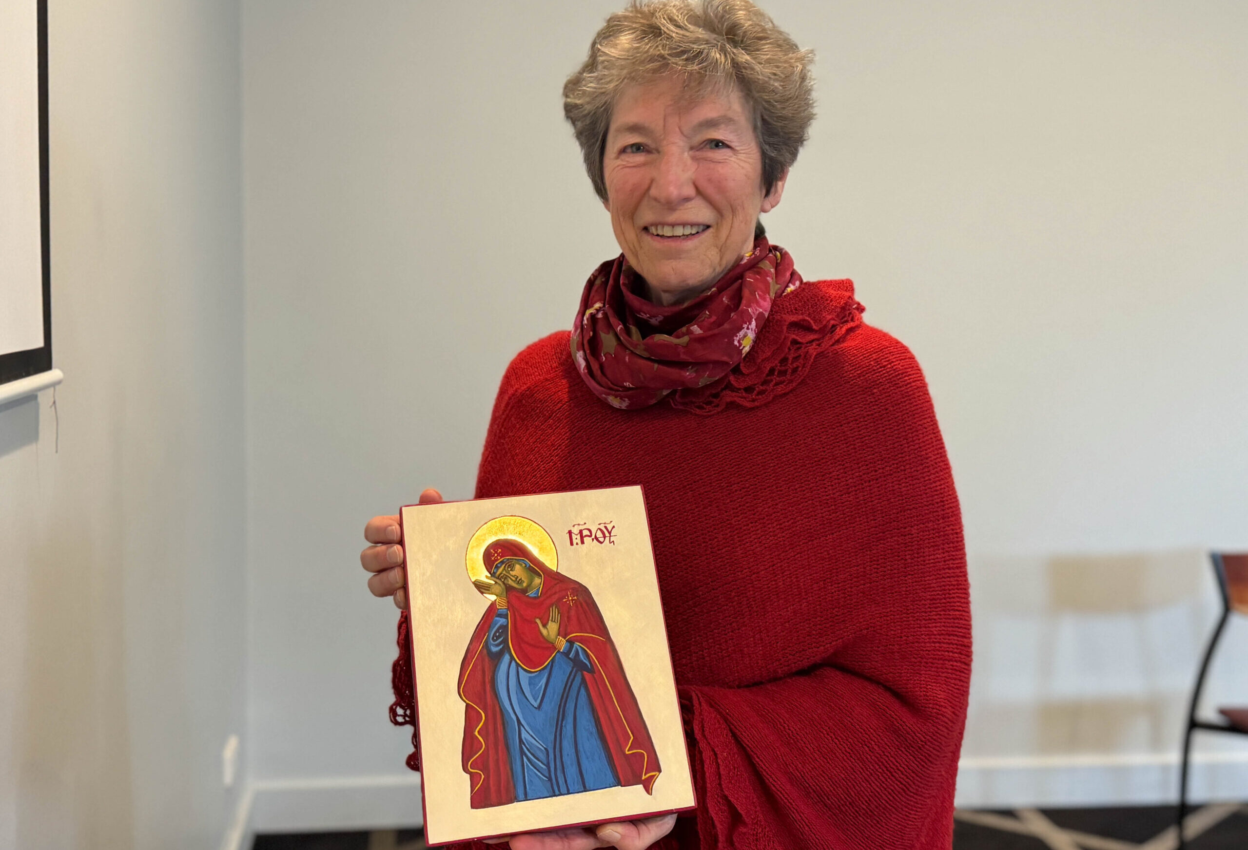 Woman holding icon