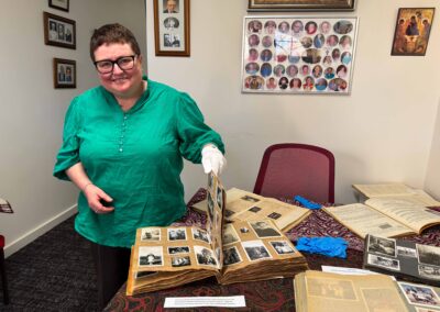 Woman holding old photo albums