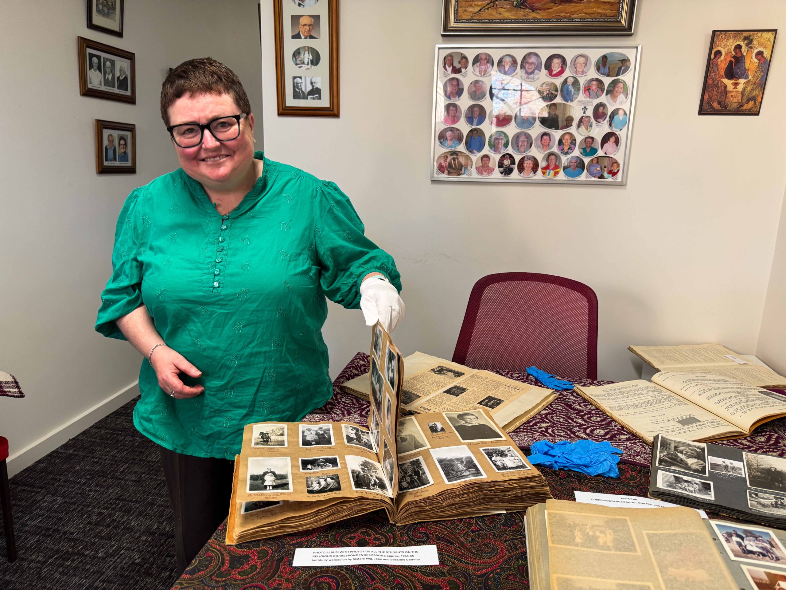 Woman holding old photo albums