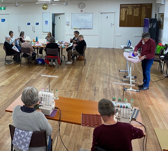 Women sewing in hall